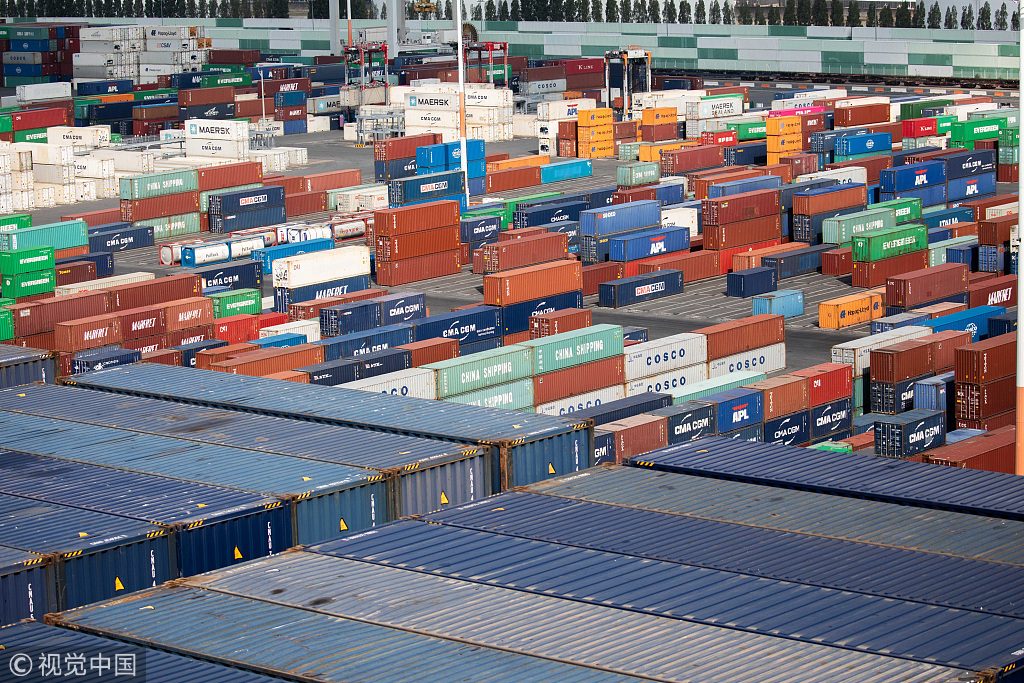 Shipping containers stand on the dockside at the Port of Le Havre in Le Havre, France, on Thursday, Sept. 6, 2018. France is benefiting from solid economic expansion in the euro zone after years of European Central Bank stimulus, and a trade dispute with the U.S. that could have led to higher tariffs seems to have subsided for now. Photographer: Christophe Morin/Bloomberg