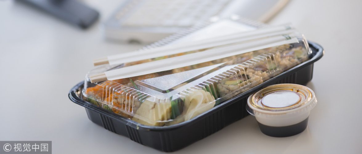 Close up of take-out lunch near computer