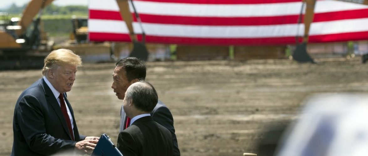 June 28, 2018; Mount Pleasant, WI, USA; President Trump (left) and Foxconn chairman Terry Gou (back) and Softbank CEO Masayoshi Son are shown during the ceremonial groundbreaking for Foxconn's factory in Mount Pleasant. The Taiwanese-Based firm has said “categorically” that it remains committed to investing the full $10 billion in what it has named the Wisconn Valley Science and Technology Park, and to creating 13,000 jobs. The factory will create display panels out of immense sheets of wafer-thin glass. Mandatory Credit: Mark Hoffman/Milwaukee Journal Sentinel via USA TODAY NETWORK