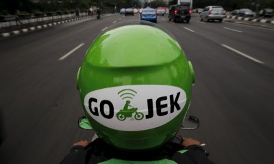 A Gojek driver rides his motorcycle through a business district street in Jakarta, June 9, 2015. Jakarta's traffic jams are a constant vexation for the city's 10 million residents. The Indonesian capital's glaring inefficiencies have also created opportunities for the likes of Makarim, who has launched a smartphone app, GO-JEK, that lets users summon a motorbike rider to weave them quickly through gridlocked traffic, deliver a meal or even get the shopping. Picture taken June 9, 2015. REUTERS/Beawiharta
