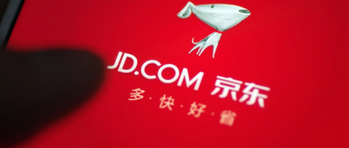 "A Chinese mobile phone user uses the mobile app of online shopping site of Chinese online retailer JD.com on his smartphone for shopping in Ji'nan city, east China's Shandong province, 25 October 2017."