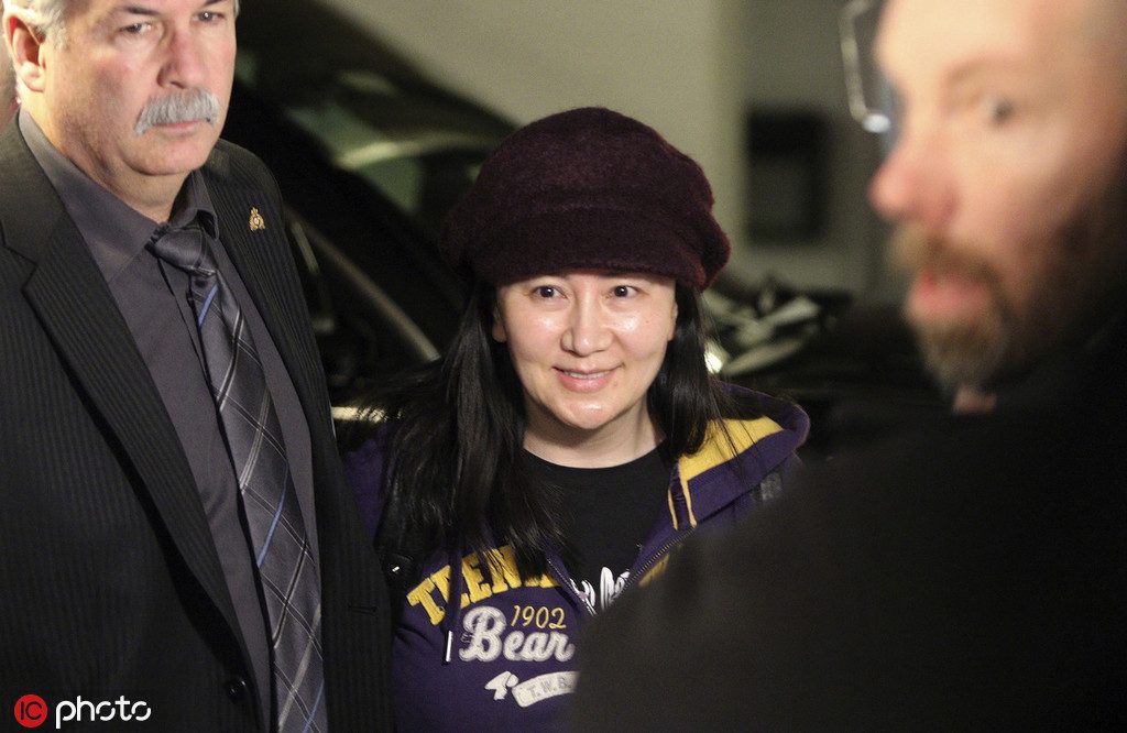Huawei chief financial officer Meng Wanzhou arrives in the parkade for a hearing at B.C. Supreme Court in Vancouver, British Columbia, Wednesday, March 6, 2019. The executive was arrested in December at Vancouver's airport at the request of U.S. authorities and Canada announced last week it intends to proceed with the extradition case. (Chad Hipolito/The Canadian Press via AP)