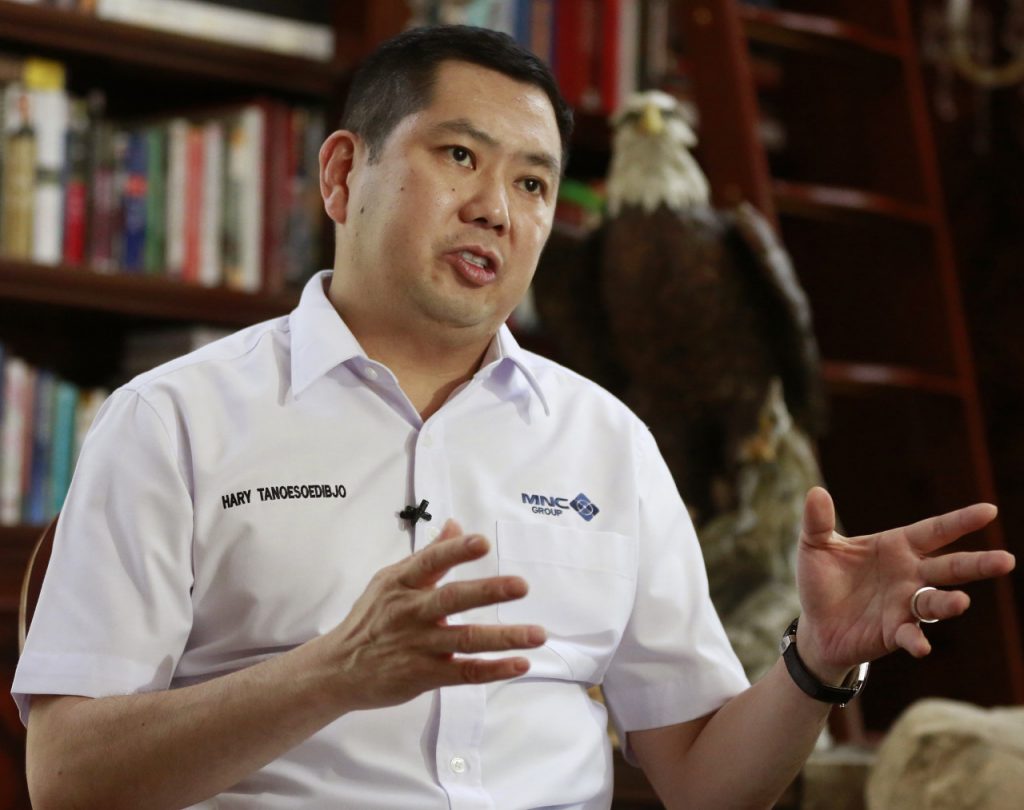 FILE - In this Jan. 14, 2017, file photo, Media Nusantara Citra (MNC) Group President and CEO Hary Tanoesoedibjo gestures during an interview with The Associated Press in Jakarta, Indonesia. Billionaire Hary Tanoesoedibjo founded his own political party and had ambitions to run for Indonesian president in 2019, but now says he’ll support current President Joko Widodo. His company is building two resorts in Indonesia - one in Bali and the other in West Java - that Trump's business is involved with through management and licensing deals. (AP Photo/Achmad Ibrahim, File)