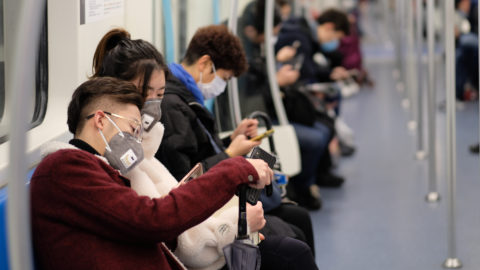 People wearing masks on a subway in Shanghai. Source: Shutterstock.