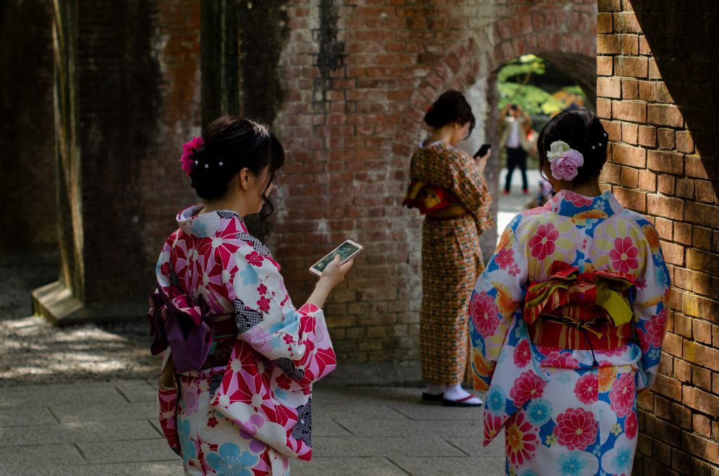 Women using phones- Photo by Launde Morel on Unsplash