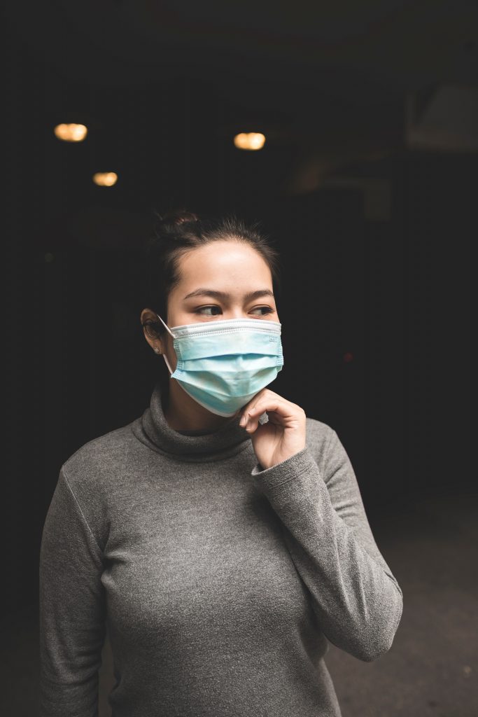 Woman wearing a face mask - Photo by Michael Amadeus on Unsplash