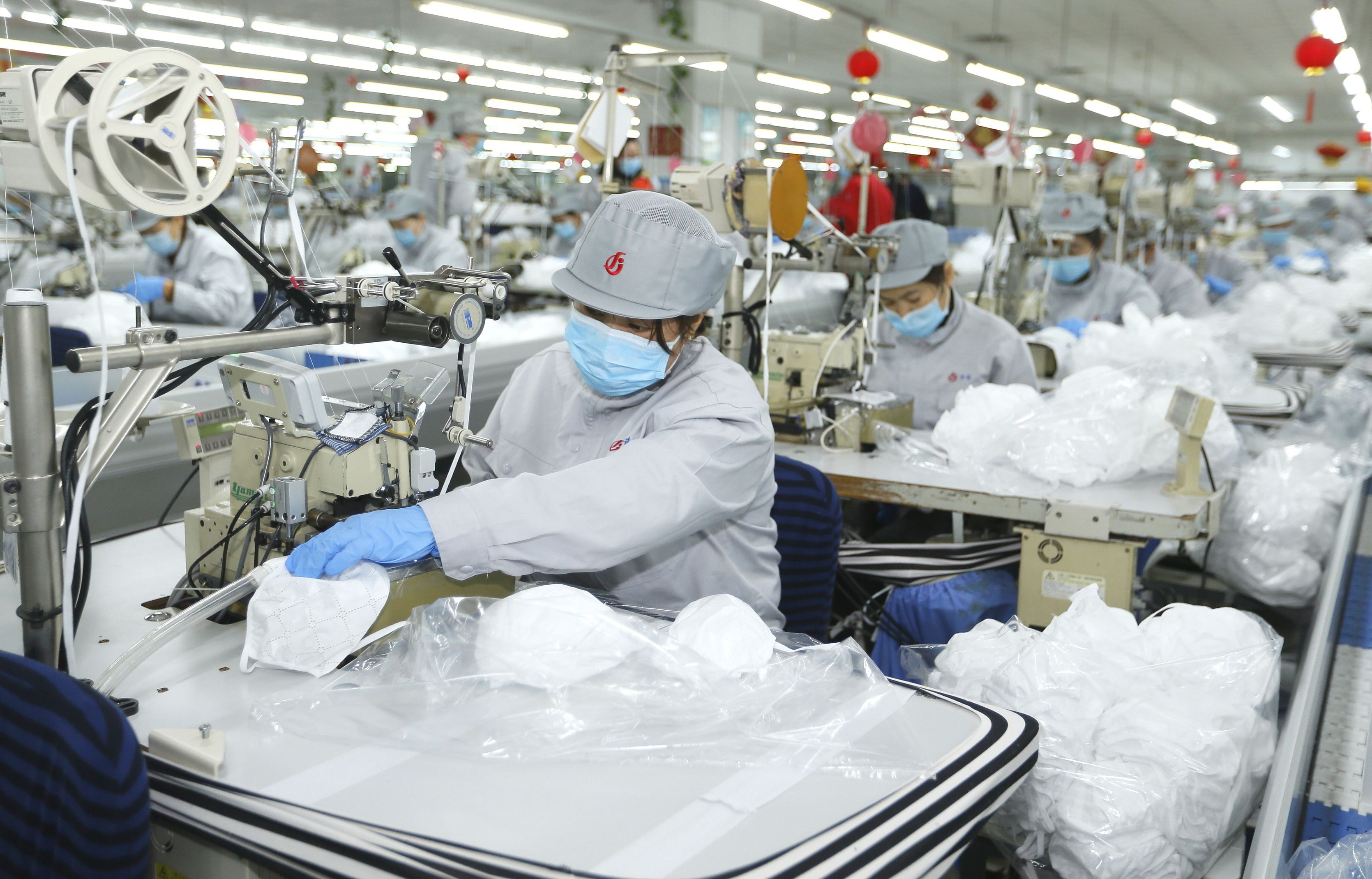 Chinese factory live-streams face mask material production amid coronavirus shortages