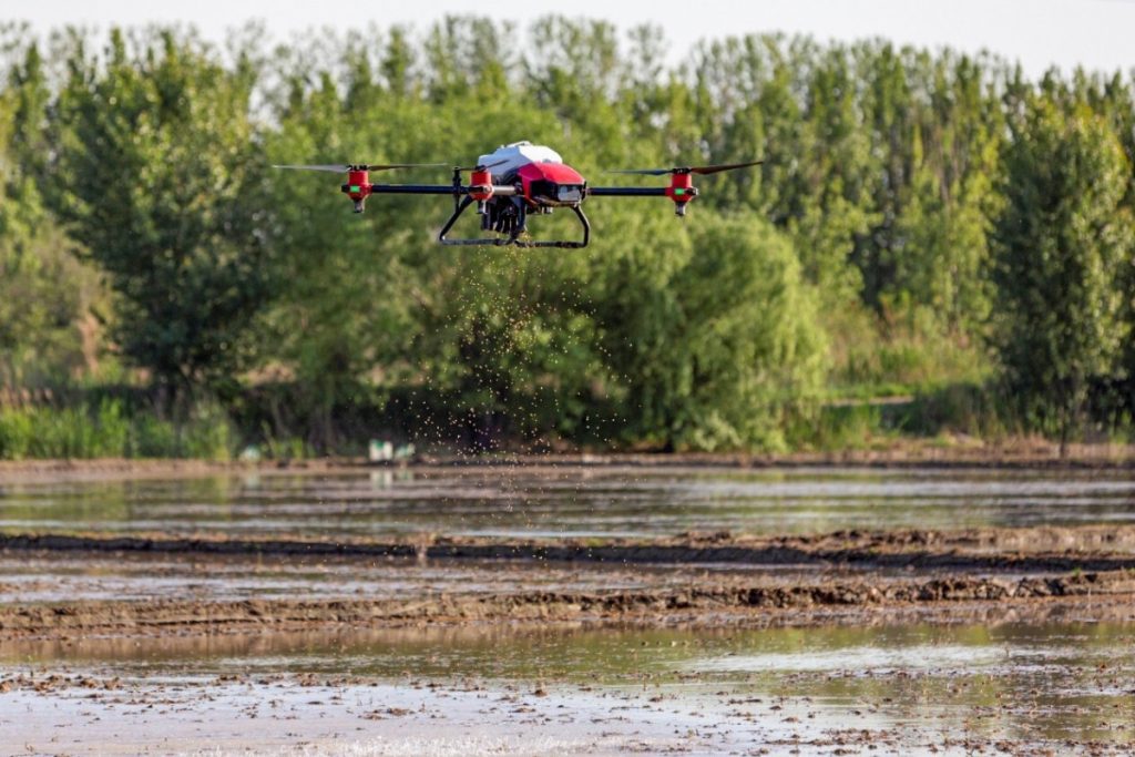 An XAG drone, attached with the company’s JetSeed granule system, scatters rice seeds at a farm in the Zengcheng District of Guangzhou, capital of southern Guangdong province. Courtesy of XAG via South China Morning Post.
