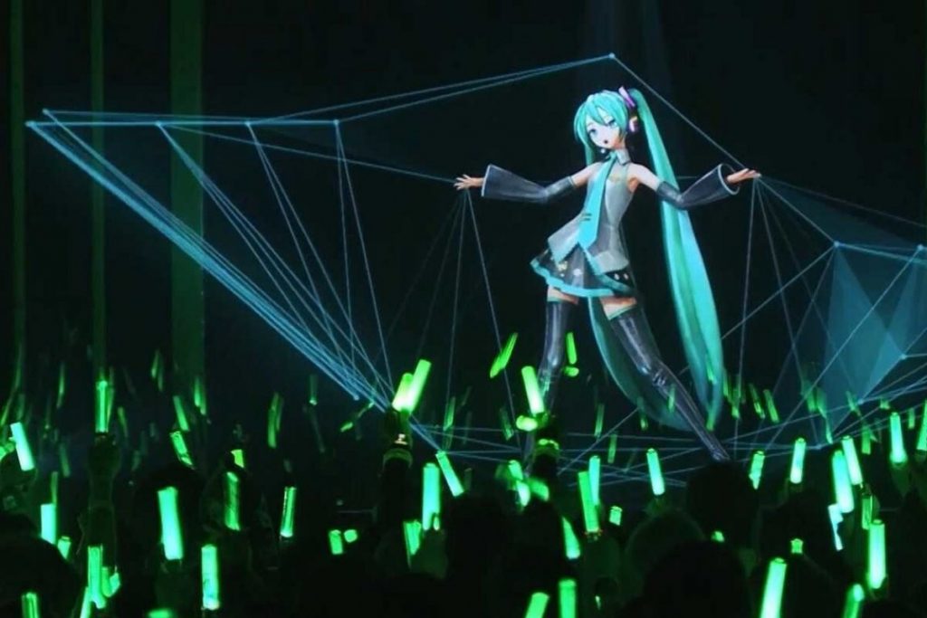 Hologram of Hatsune Miku performs live on stage in Japan. Photo via South China Morning Post.