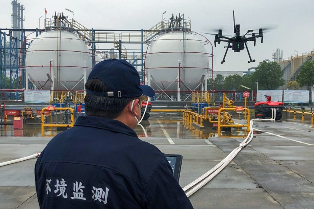 An inspector checks air quality with the help of a drone equipped with the Sniffer4D sensor. Courtesy of Soarability via South China Morning Post.