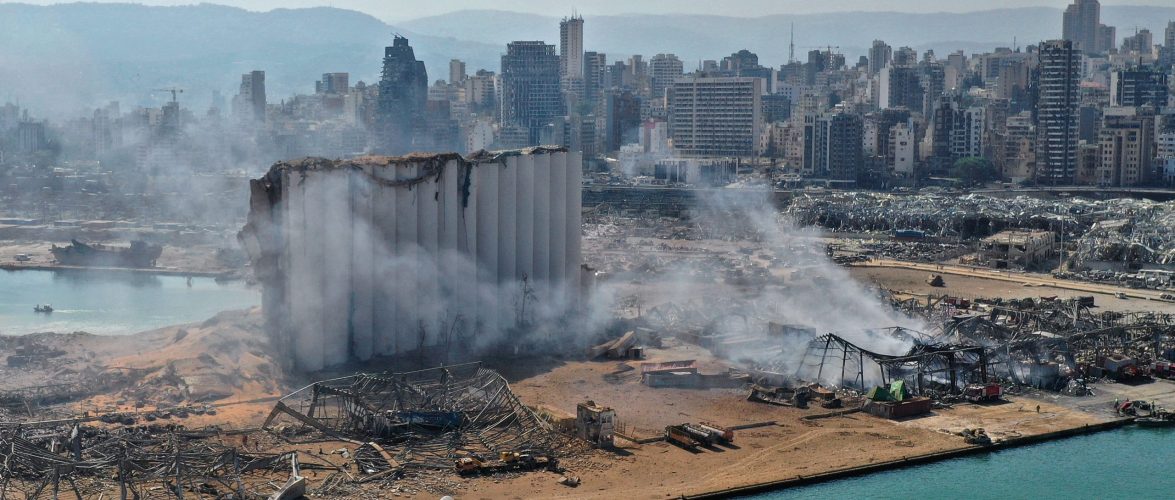 An aerial view shows the massive damage done to Beirut port's grain silos and the area around it on August 5, 2020, one day after a mega-blast tore through the harbor in the heart of the Lebanese capital. Source: Shutterstock.