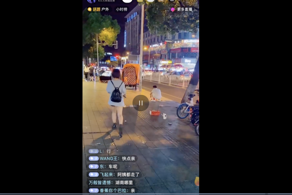 A livestreamer films himself following young women on the street before being banned from the Douyin platform. Screenshot from Douyin via Weibo and South China Morning Post.