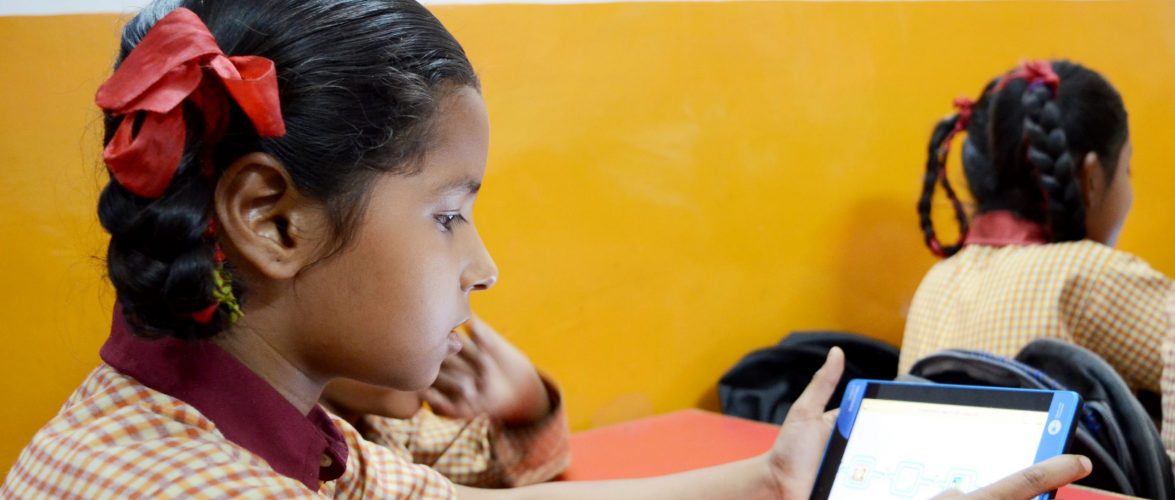 A student learning through the tablet and course material provided by ConveGenius. Photo courtesy: ConveGenius