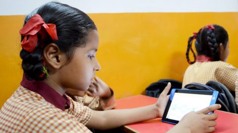 A student learning through the tablet and course material provided by ConveGenius. Photo courtesy: ConveGenius