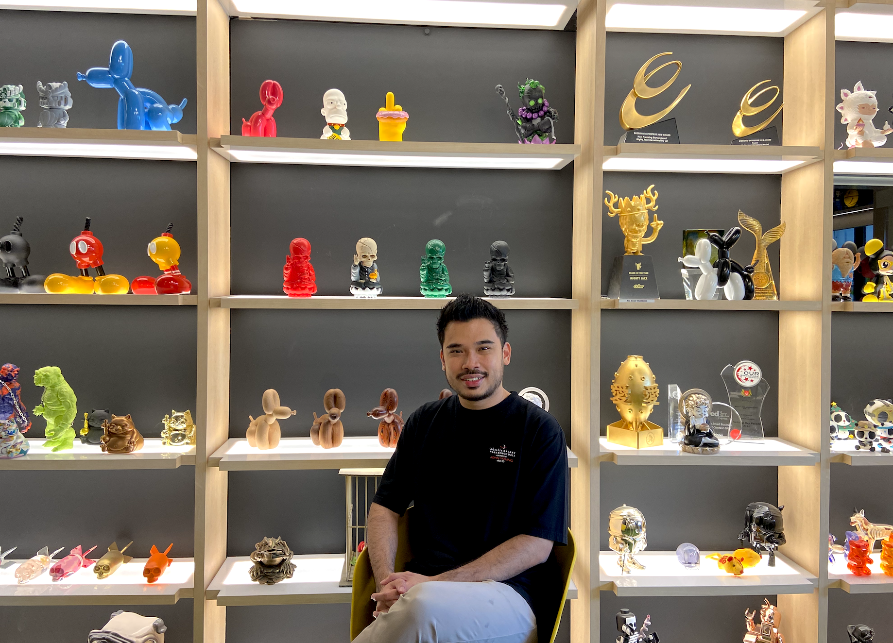 Jackson sits in front of a few pieces called Hell Lotus. 