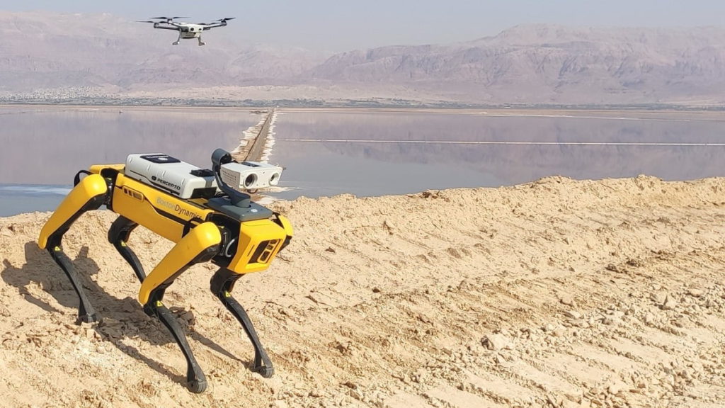 Percepto's Sparrow drone flies above Boston Dynamics' Spot robot. Courtesy of Percepto and Boston Dynamics via NoCamels.
