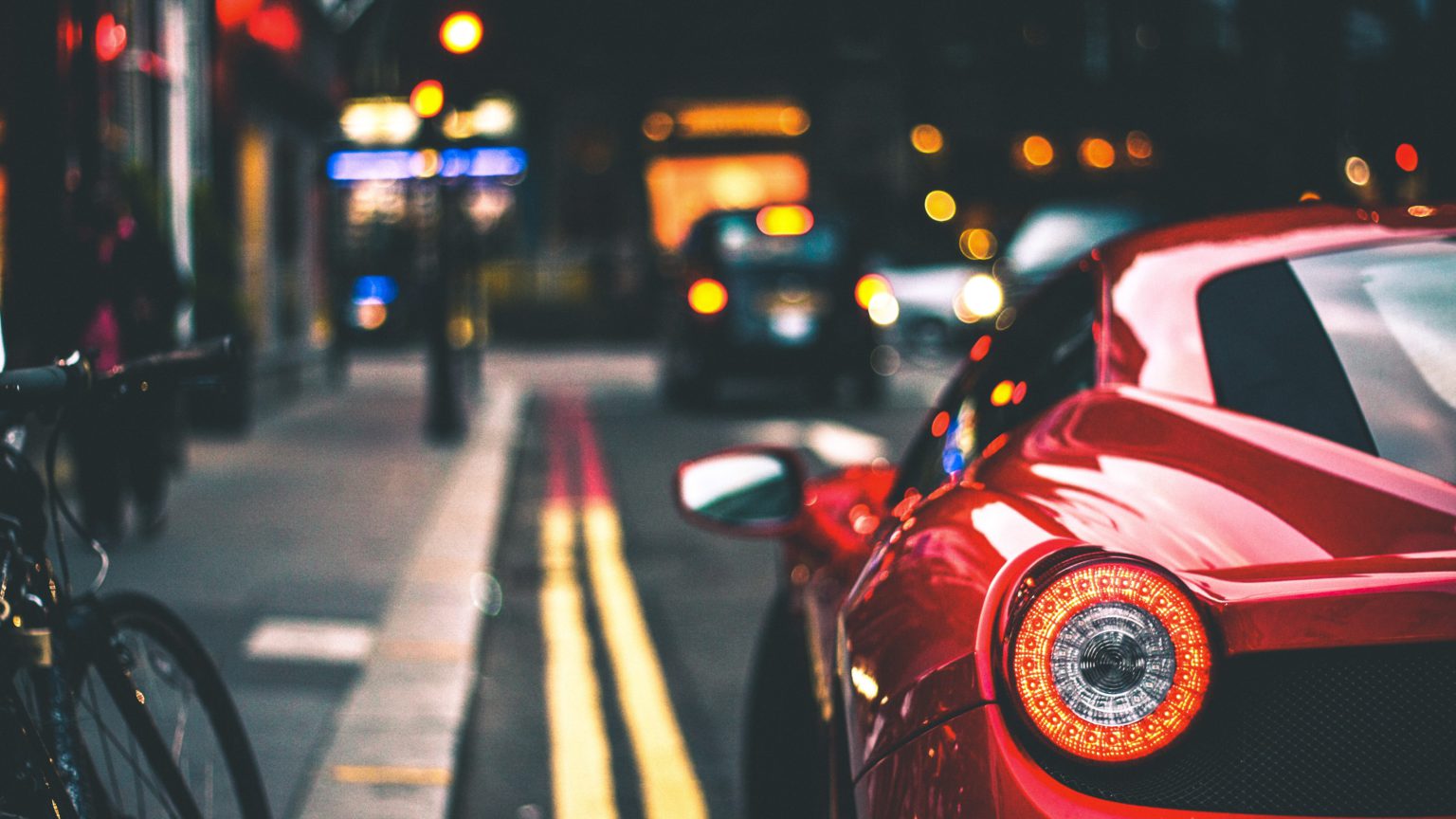 Light of a Ferrari 458 in the streets of London. Photo by Marc Kleen on Unsplash