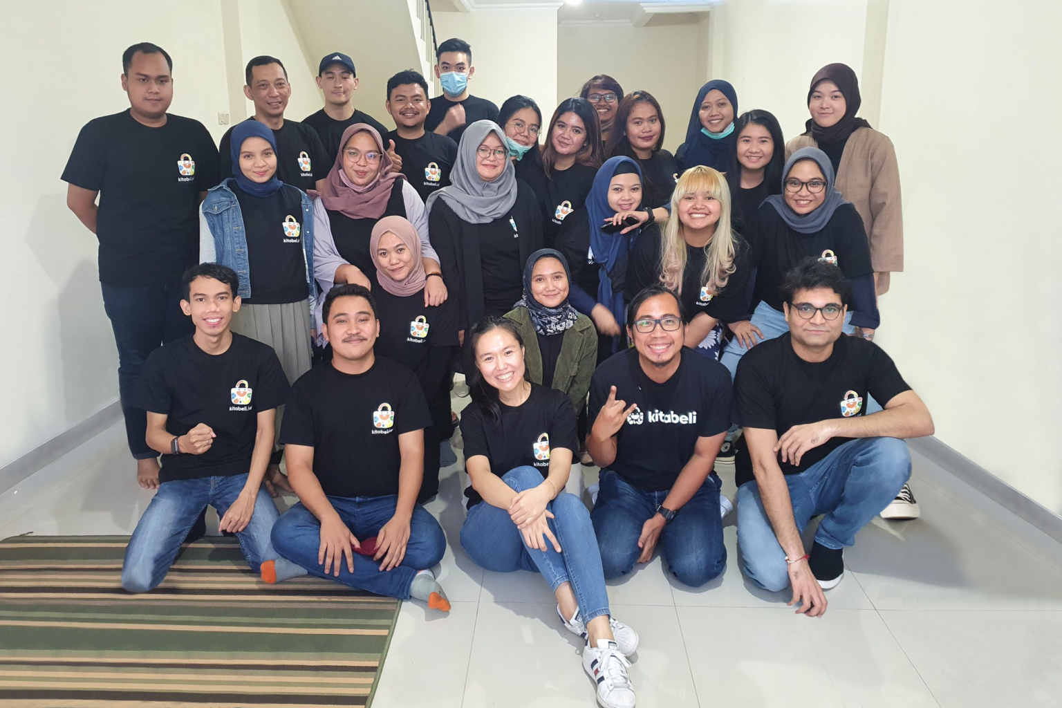 Prateek Chaturvedi
(CEO and Co-founder of KitaBeli) is seated in the front right corner,
while Ivana Tjandra (COO and Co-founder of KitaBeli) is seated front, center. Photo courtesy of KitaBeli.