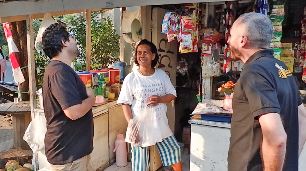 Krishnan Menon, Lorenzo Peracchione, and a BukuKas Merchant. Photo courtesy of BukuKas.