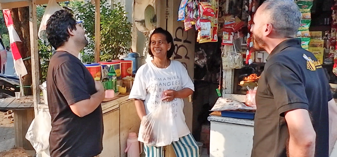 Krishnan Menon, Lorenzo Peracchione, and a BukuKas Merchant. Photo courtesy of BukuKas.