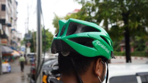 Before the coup, a full-time delivery rider could earn up to USD 90 per week in Yangon. Photo by KrASIA. 