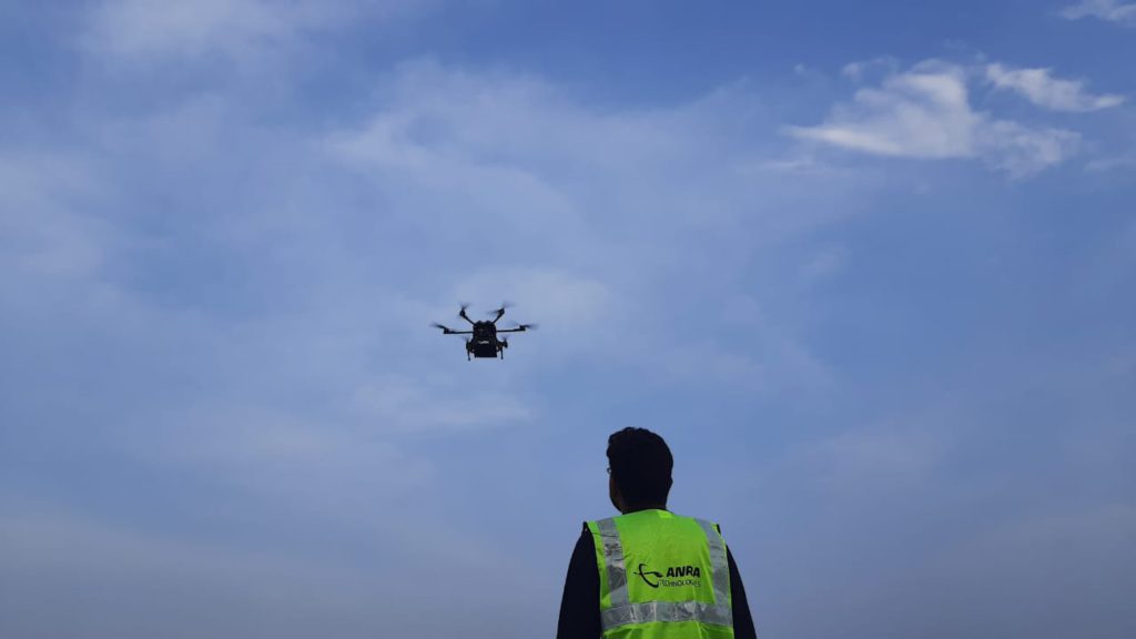 A pilot from Anra Technologies operating a drone.