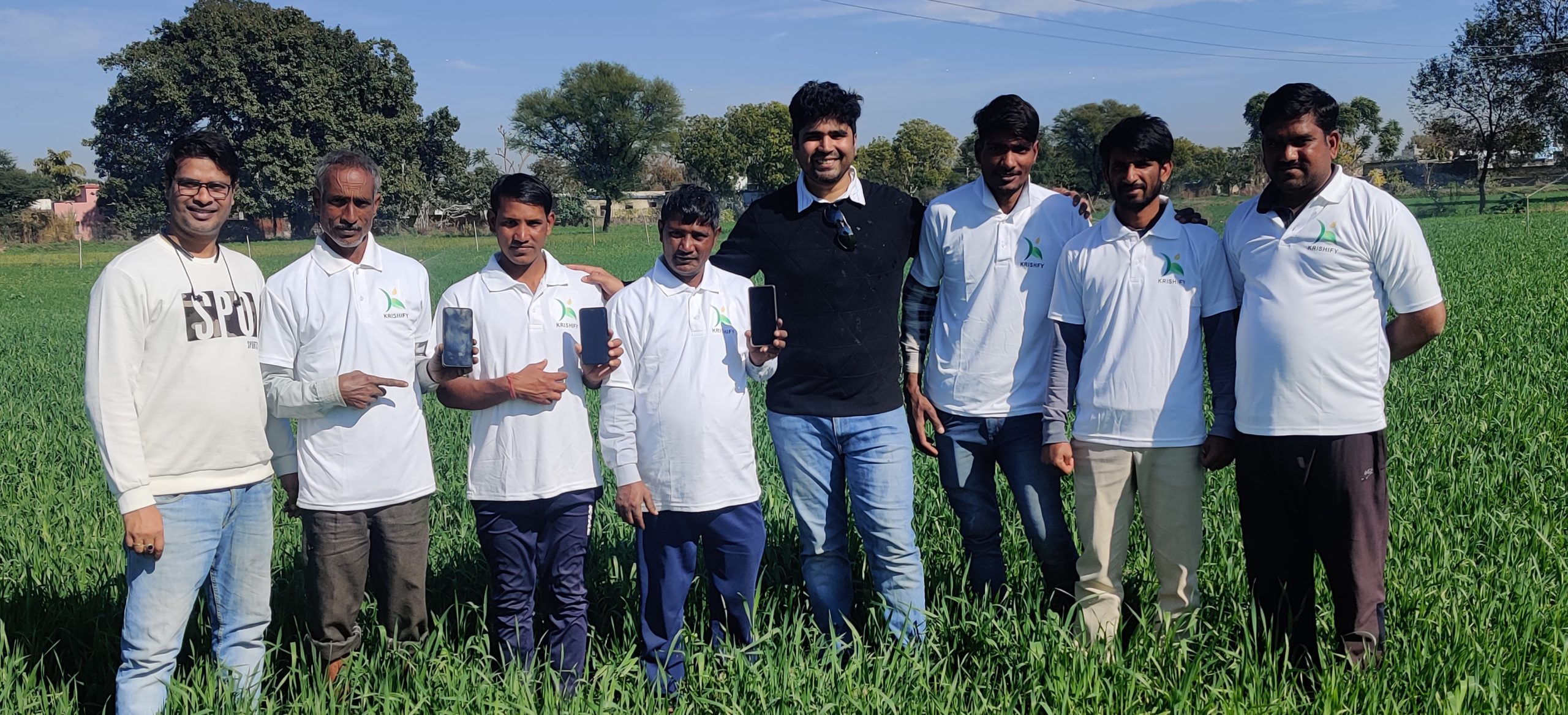 Rajesh Ranajan, co-founder of Krishify posing with salespeople at one of the farms. 