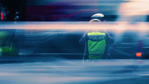 Indonesian police by Tusik on Unsplash.