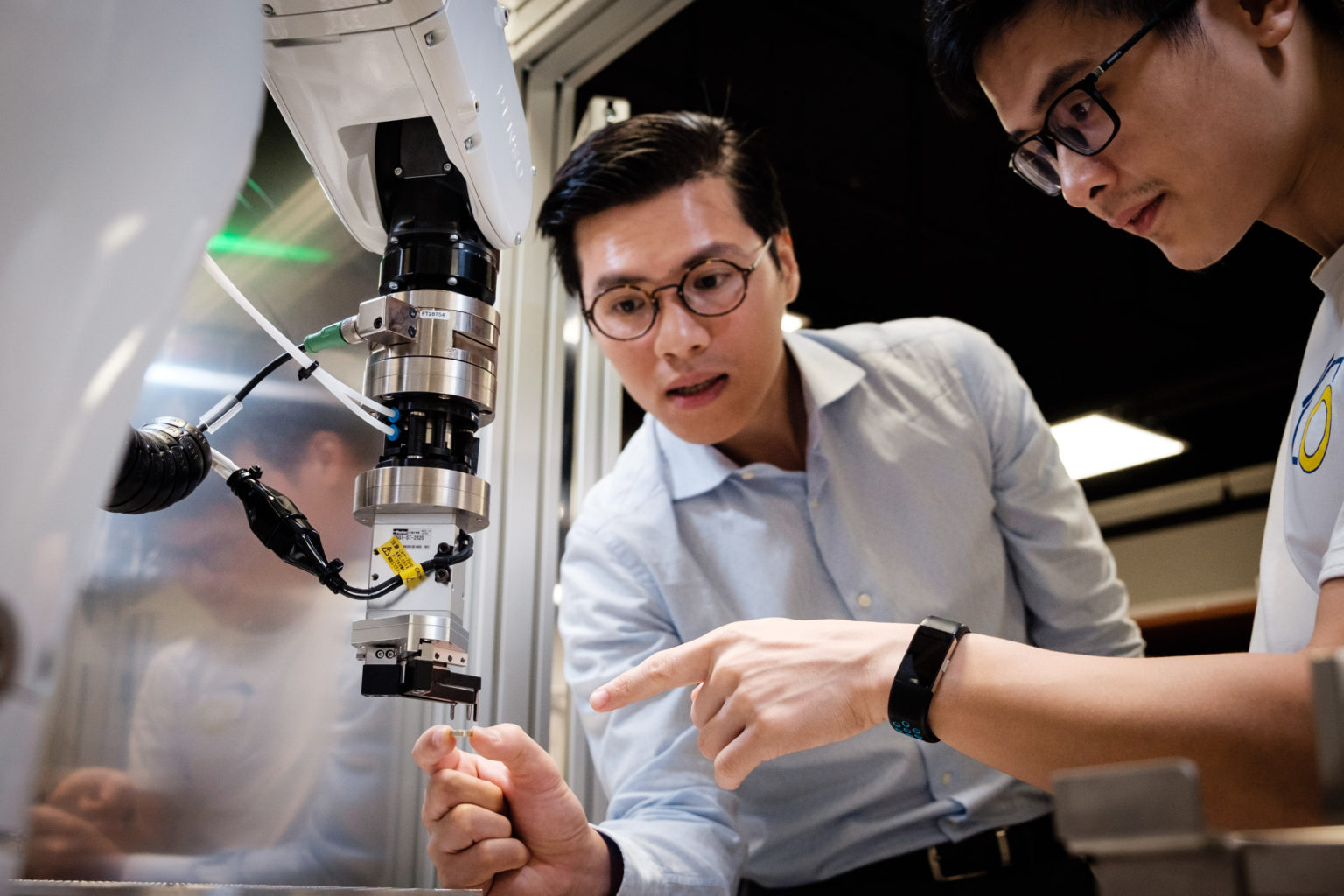 Photo of Pham Quang Cuong (left) and Hung Pham, co-founders of Eureka Robotics. Photo courtesy of Singapore's Nanyang Technological University.