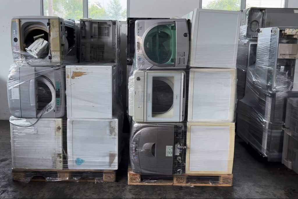 Old refrigerators and washing machines that have been collected and sorted at the ALBA facility.