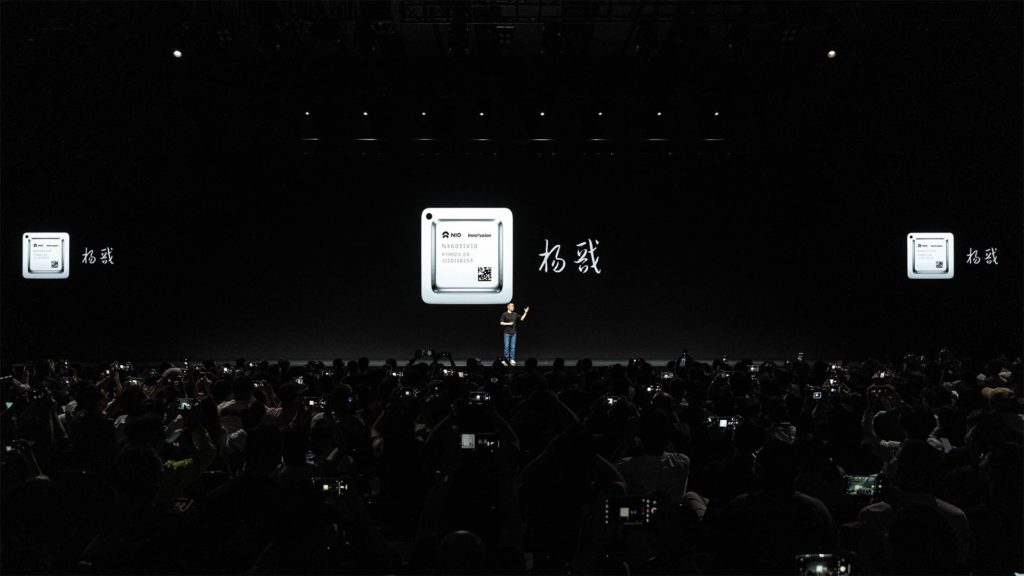 Photo of Nio CEO William Li introducing the Yangjian chip during the Nio IN 2023 event.