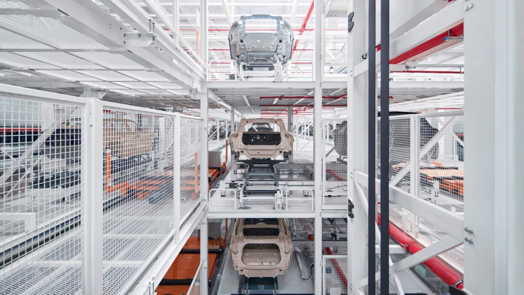 Photo of a vertical car garage in Nio’s F2 factory.