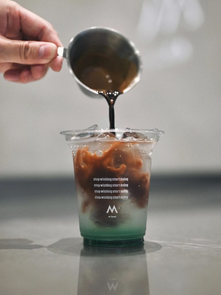 Promotional image of M Stand’s “tom yum” sparkling americano.