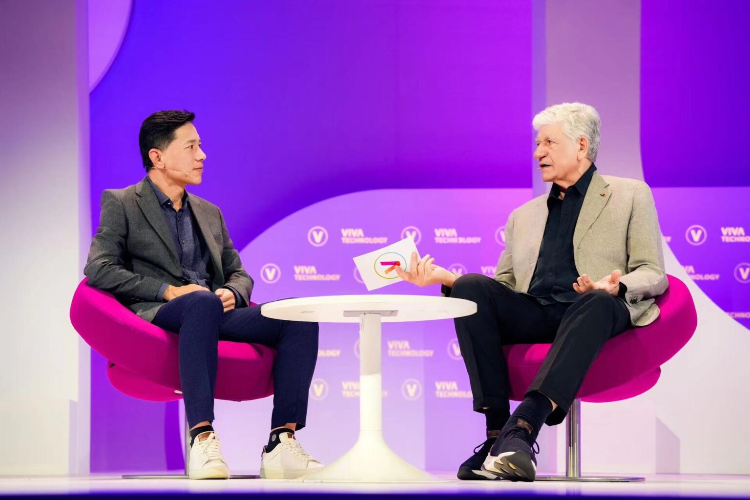 Photo of Robin Li (left), co-founder and CEO of Baidu, and Maurice Levy, chairman of the supervisory board of Publicis Groupe, speaking during the 2024 VivaTech event in Paris. Photo courtesy of Baidu.