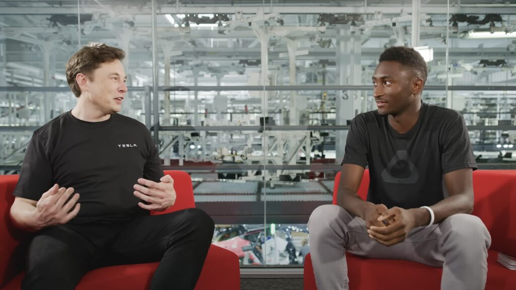 Screenshot of a video showing Elon Musk (left) in conversation with Marques Brownlee, a technology-focused YouTube content creator, during an interview filmed and published in August 2018.