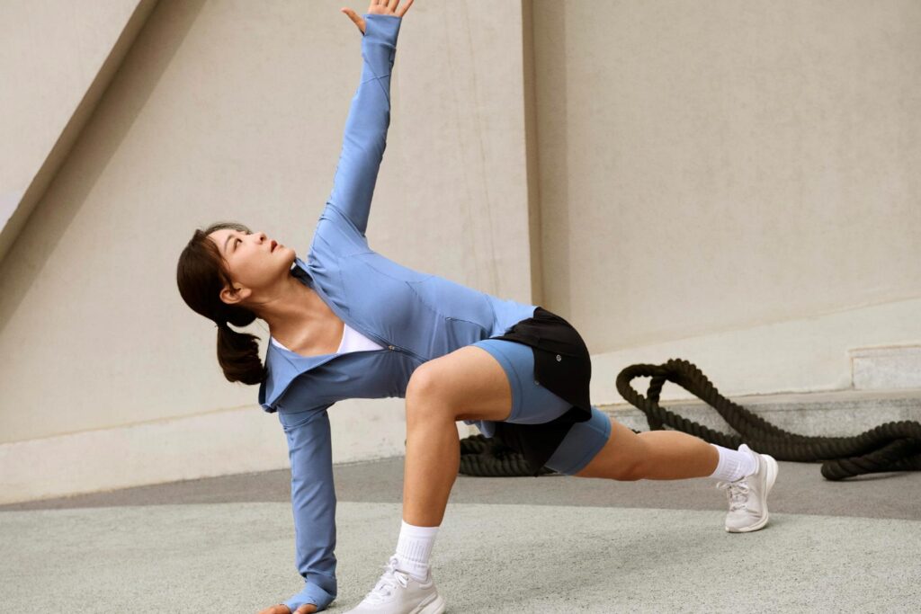 Photo of Jia Ling, Lululemon’s latest brand ambassador, showcasing the “Mist Over” windbreaker, “License To Train” high-waisted shorts, “Wunder Train” high-waisted tight shorts, and “Chargefeel 2” running shoes.