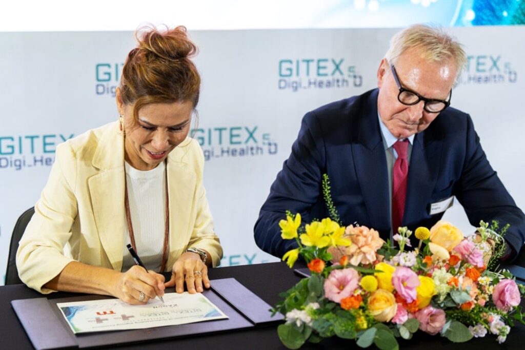 Photo of Trixie LohNirmand (left), CEO of Kaoun International, and Gernot Ringling, managing director of Messe Dusseldorf Asia, signing a partnership agreement for the Thailand edition of GITEX Digi Health 5.0, set for September 2025. The signing took place on the sidelines of Medical Fair Asia 2024.