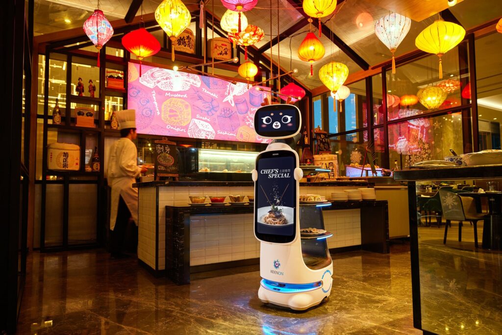 Photo of Dinerbot T10, a delivery robot developed by Keenon Robotics.