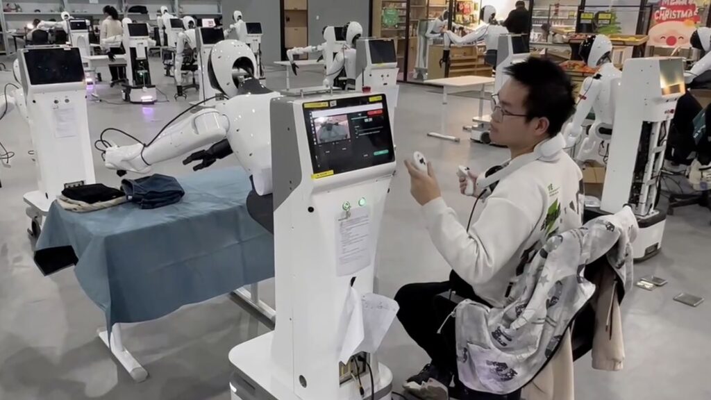 Photo of Agibot’s staff members, seen collaborating with humanoid robots throughout the company's data acquisition center, gathering data by simulating real-world activities.