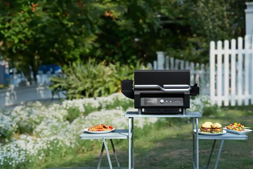 Photo of an outdoor setup showcasing Asmoke’s smart electric grill.