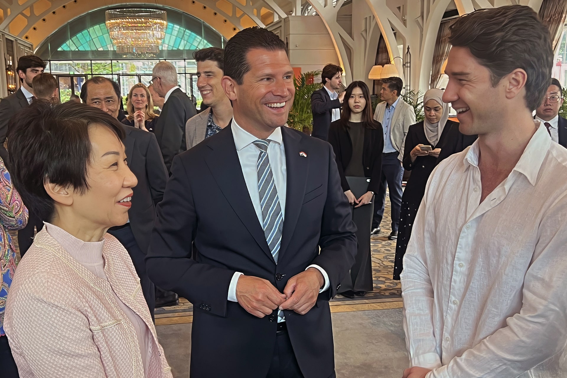 Photo of Vince Vissers (right) speaking with Singaporean minister Grace Fu (left) and Dutch minister Dirk Beljaarts during a government-led ceremony marking Firsty’s partnership with GlobalTix.