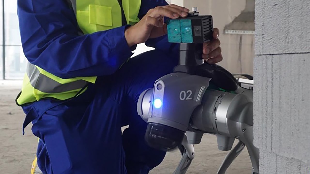 Photo shows the installation of the Odin 1 module on a quadruped robot intended for industrial deployment.
