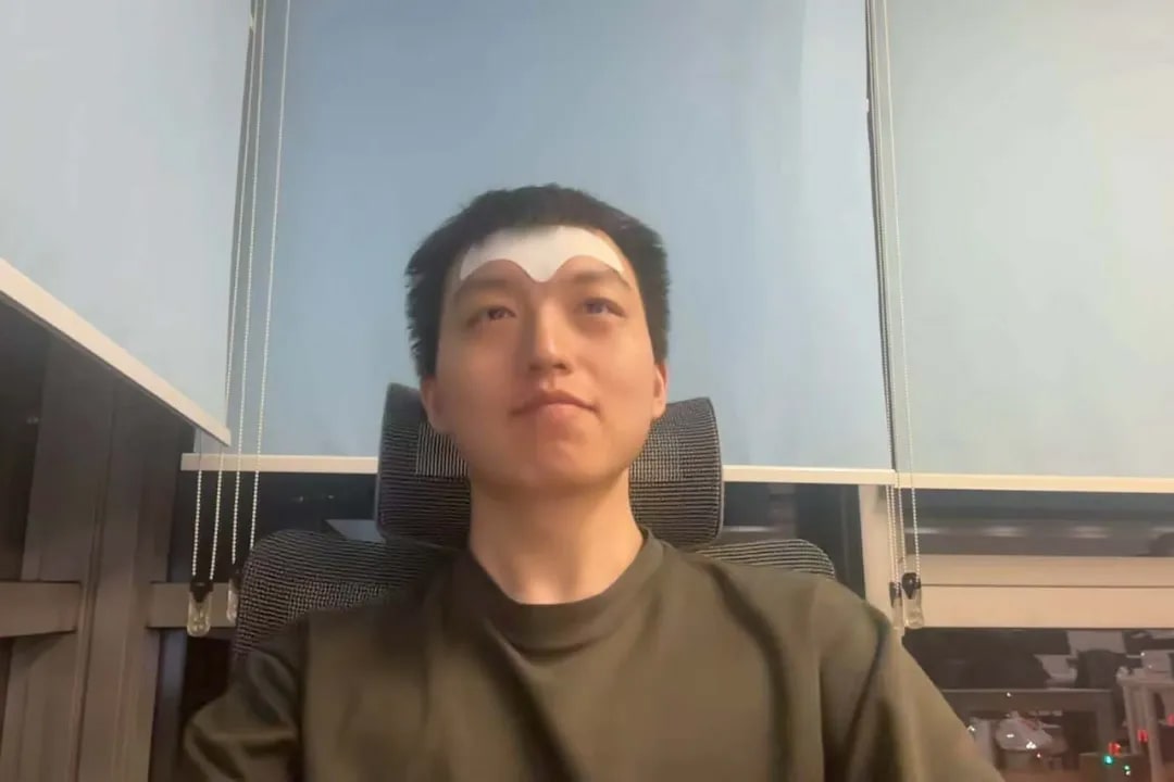 Selfie of Cao Tong, taken while working at a coworking space near Tsinghua University.