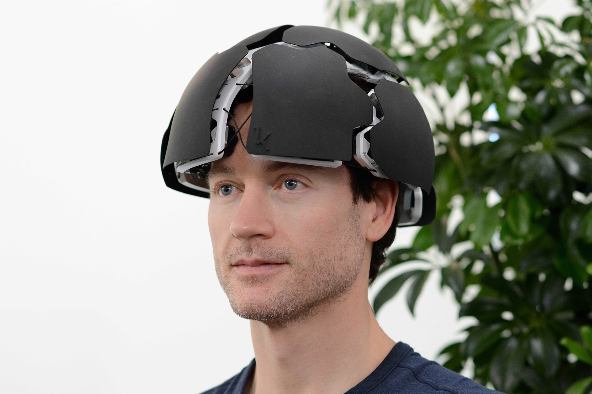 Photo of Bryan Johnson donning the Kernel Flow, a brain measurement headset that can be used to analyze cortical brain activity.