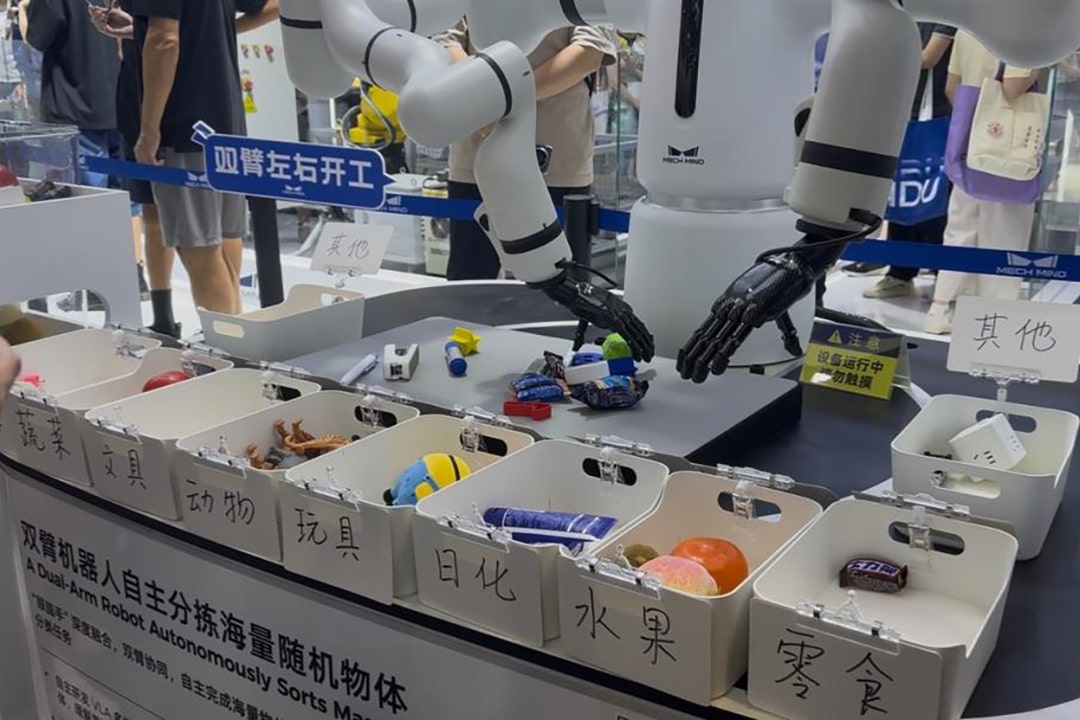 Photo of a dual-arm robot developed by Mech-Mind Robotics, showcased sorting items at WAIC 2025.