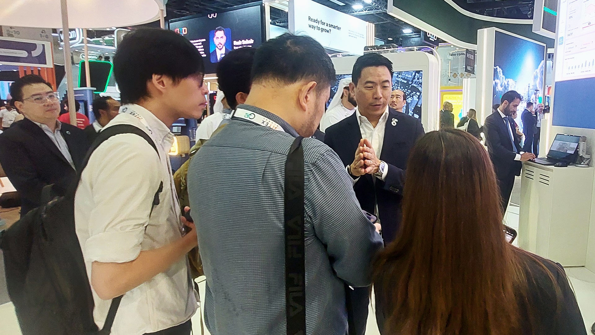 Journalists (pictured) from a media delegation organized by KrASIA on behalf of the Dubai World Trade Centre (DWTC) receive a walkthrough of Presight’s technologies from CEO Thomas Pramotedham at the company’s GITEX Global 2025 booth ahead of a closed-door media interview.