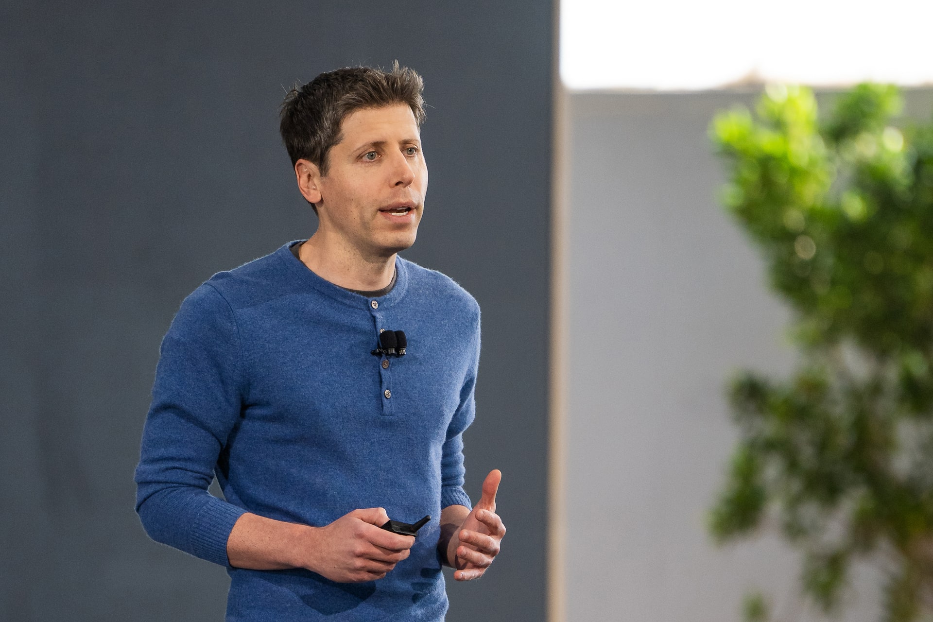 Photo of Sam Altman speaking at OpenAI DevDay on October 7.