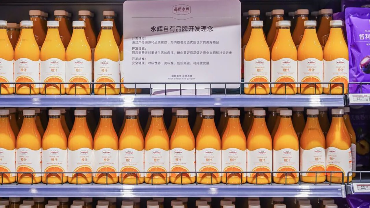 Photo of multiple bottles of Yonghui’s private-label orange juice.