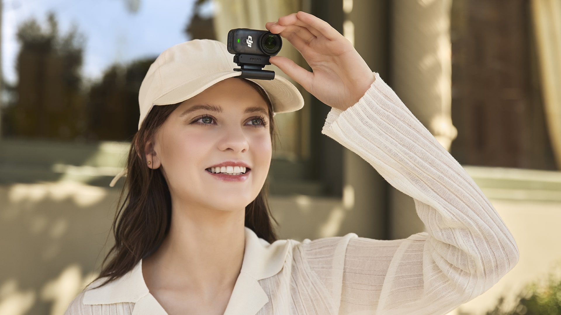 Photo showcases the magnetic clip design of DJI’s Osmo Nano, enabling the compact camera to attach effortlessly to a cap or chest strap for hands-free shooting.