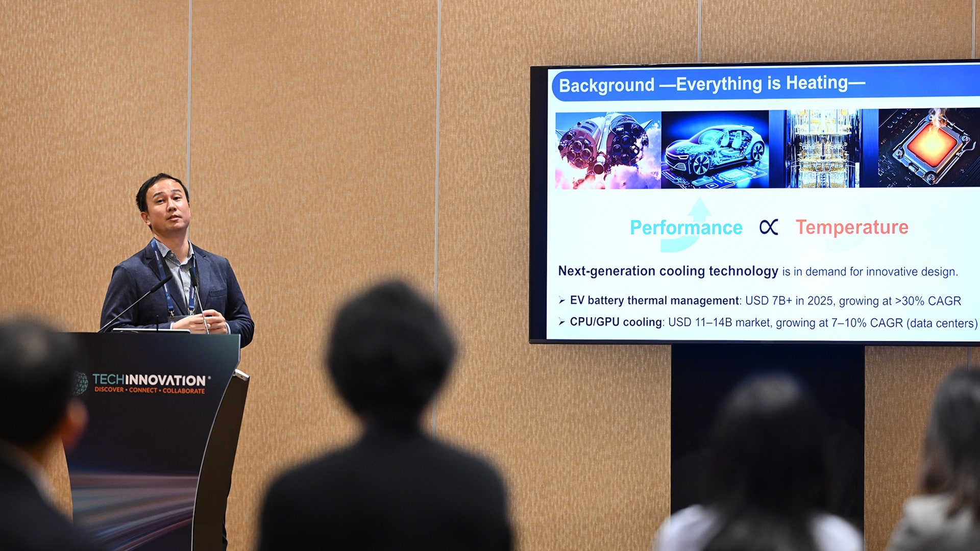 Photo of Kentaro Yaji from the University of Osaka, speaking during the event about his research on thermal-fluid topology optimization, which aims to address current heat management challenges.